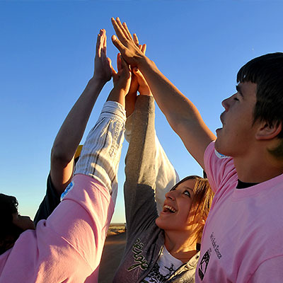 Group of students high-fiving